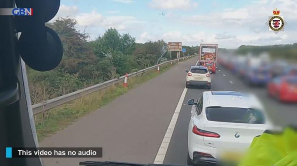 Shocking moment queue-dodging motorist puts lives at risk by using hard shoulder on the M5 motorway