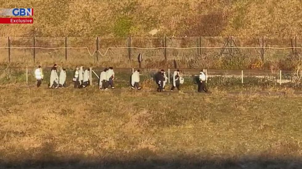 Watch EXCLUSIVE footage as migrants manage beach landing near Dover
