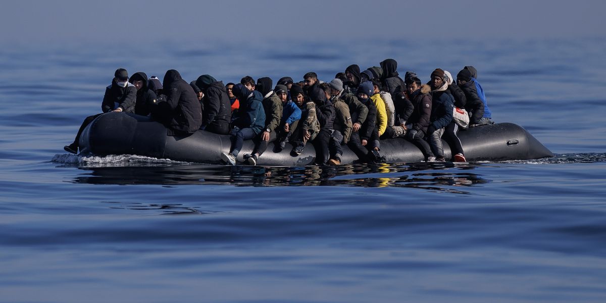 NextImg:Asylum seeker ran people-trafficking ring bringing migrants across the Channel while working in chicken shop
