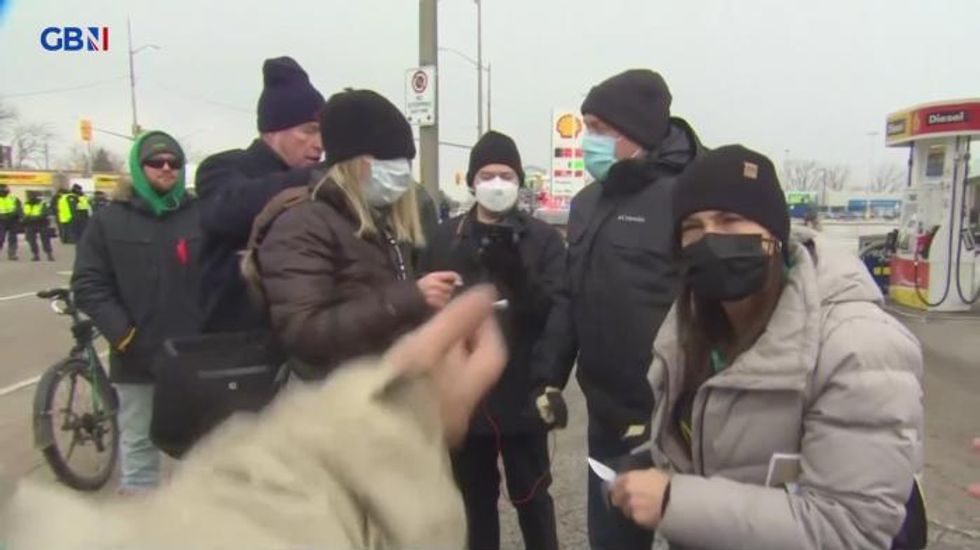 Canadian police tell journalists to 'leave the area' of Covid-19 protests