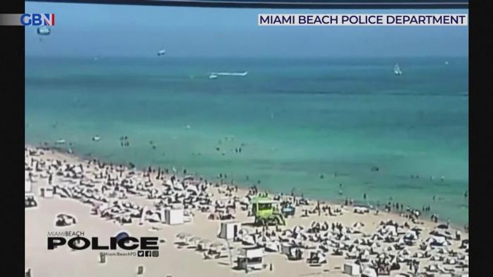 Shocking moment helicopter crashes into sea near Miami Beach swimmers