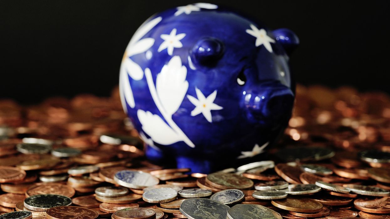 1p coin and other coins with piggy bank in pictures