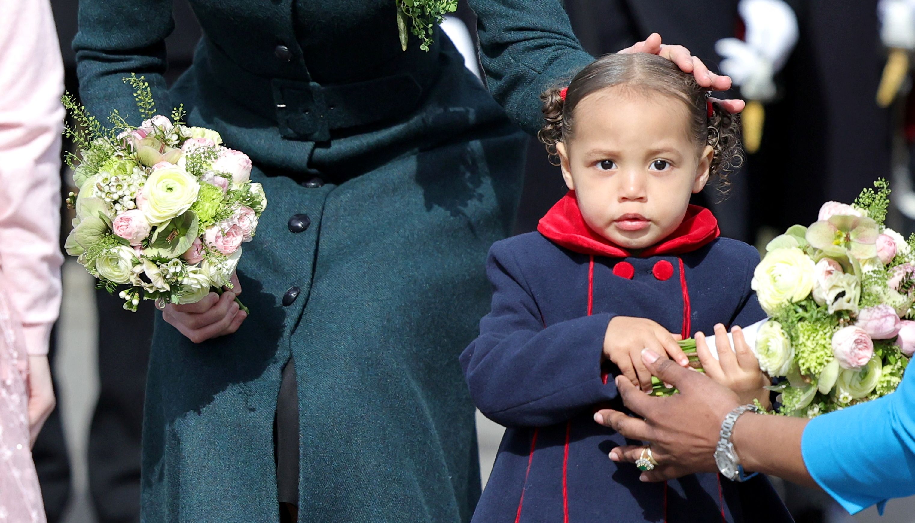 20-month-old Gaia Money, the daughter of Commanding Officer Robert Money, presented the Duchess with a bouquet as she attended the Irish Guards' St. Patrick's Day Parade at Mons Barracks in Aldershot