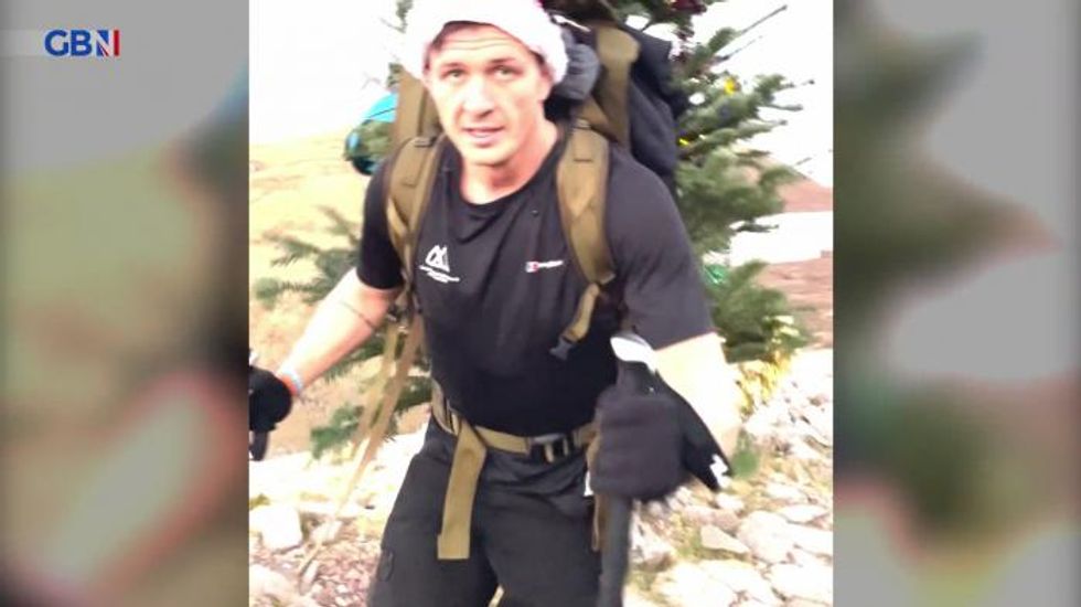 Disabled former rugby star tackles 11,490 metres with Christmas tree for charity