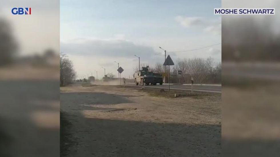Ukrainian man stops advancing Russian tanks as Putin's invasion gathers pace - WATCH