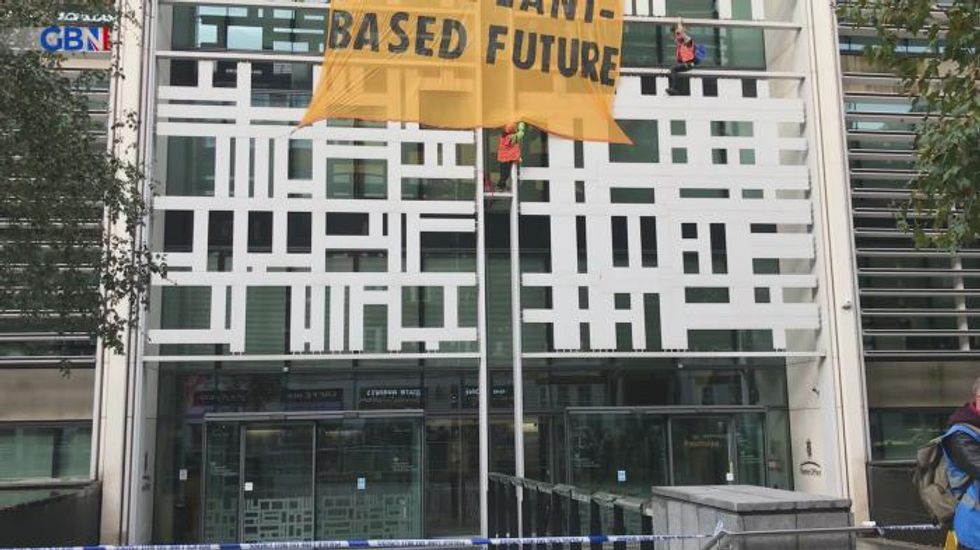 Activists scale Defra building in call for meat and dairy farm subsidies to end