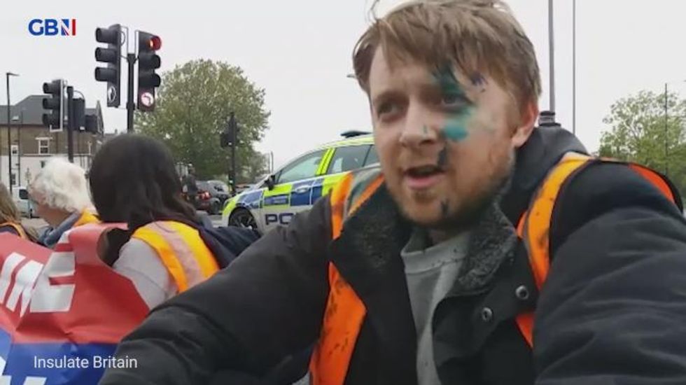 Insulate Britain protesters squirted with ink as they block roads