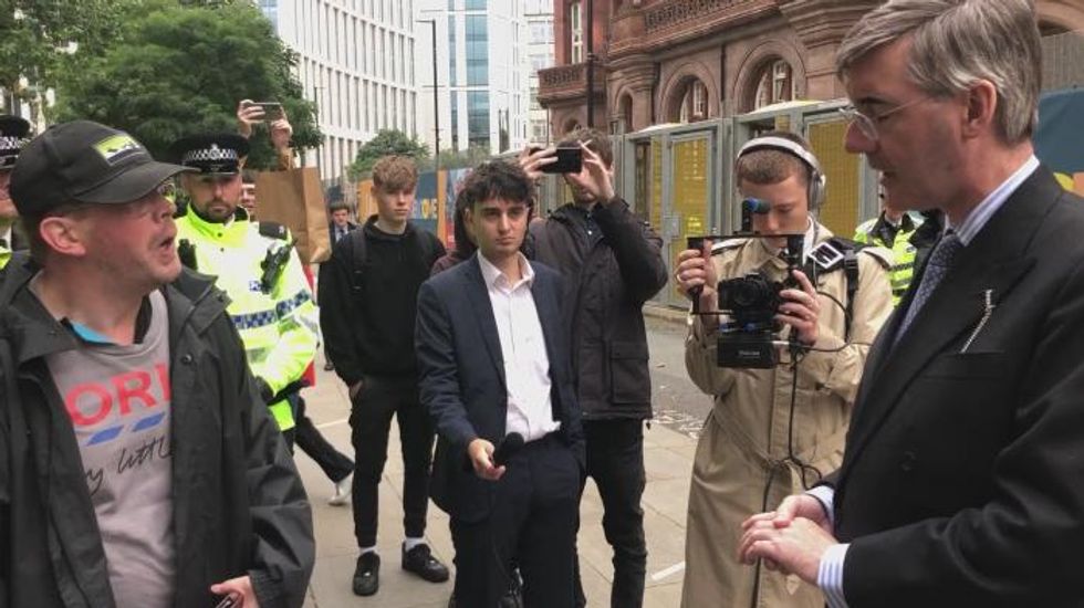 Conservative conference: Jacob Rees-Mogg confronted by disability campaigner in street over Tory policies