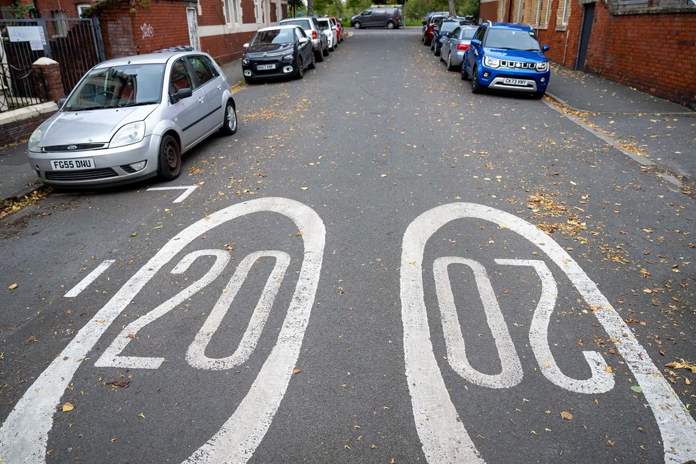 A 20mph speed limit marking on a residential road