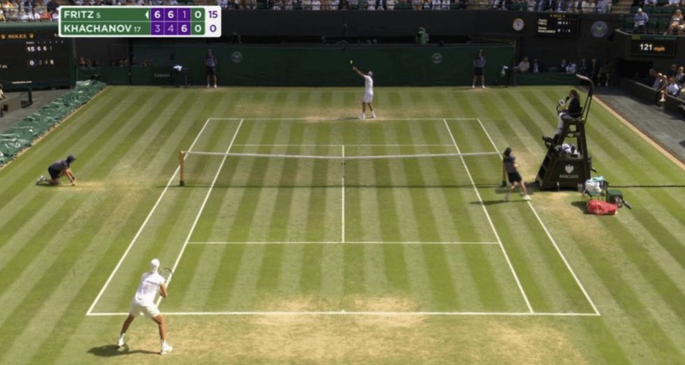 A ball kid had not yet returned to their post before the game resumed, prompting an error from the line calling system