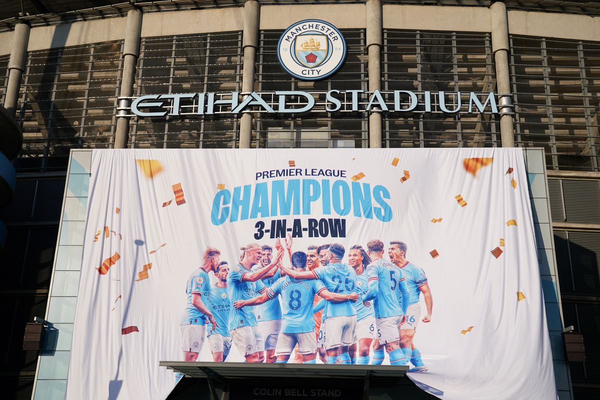 A banner celebrating City's title success on display at the Etihad Stadium