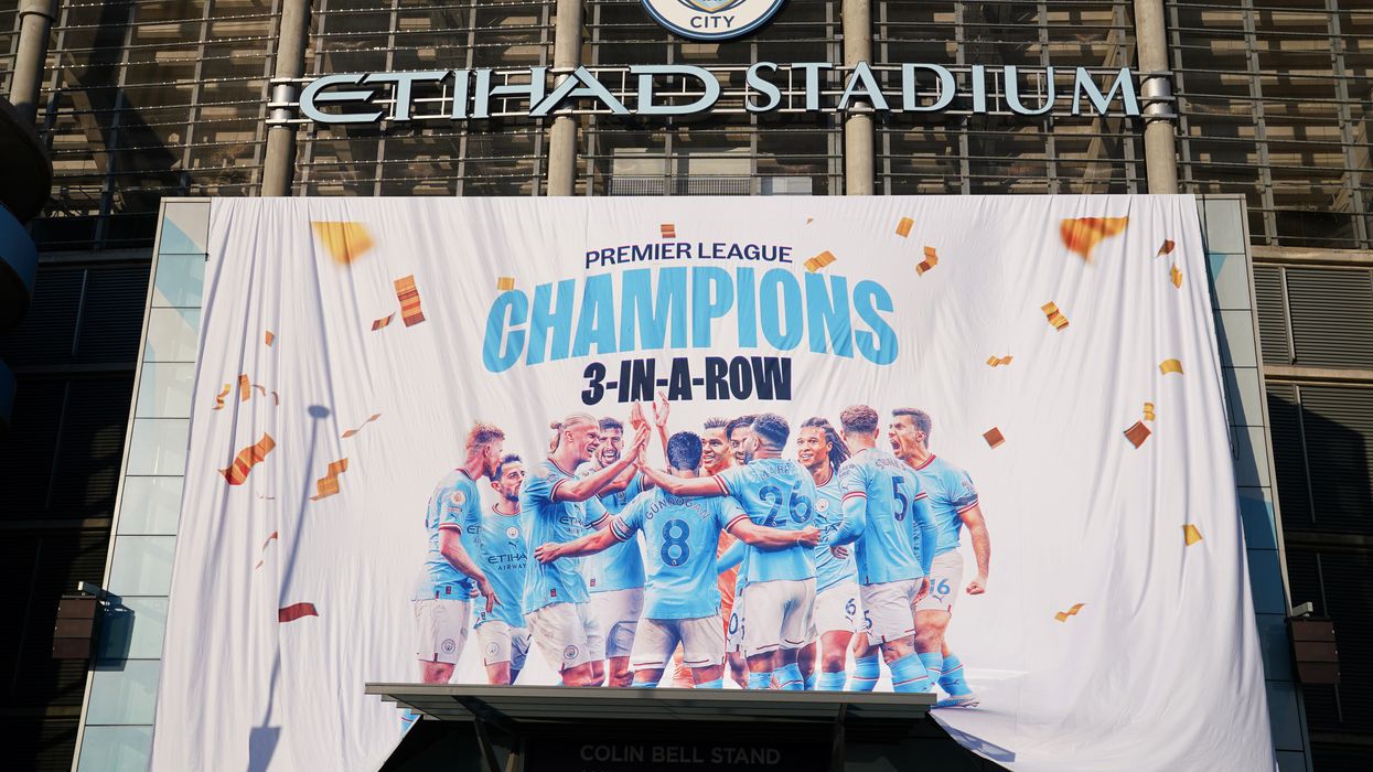 A banner celebrating City's title success on display at the Etihad Stadium