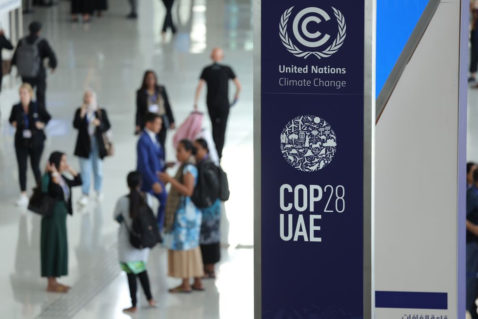 A banner hangs in a venue at the UNFCCC COP28 Climate Conference the day before its official opening on November 29, 2023 in Dubai