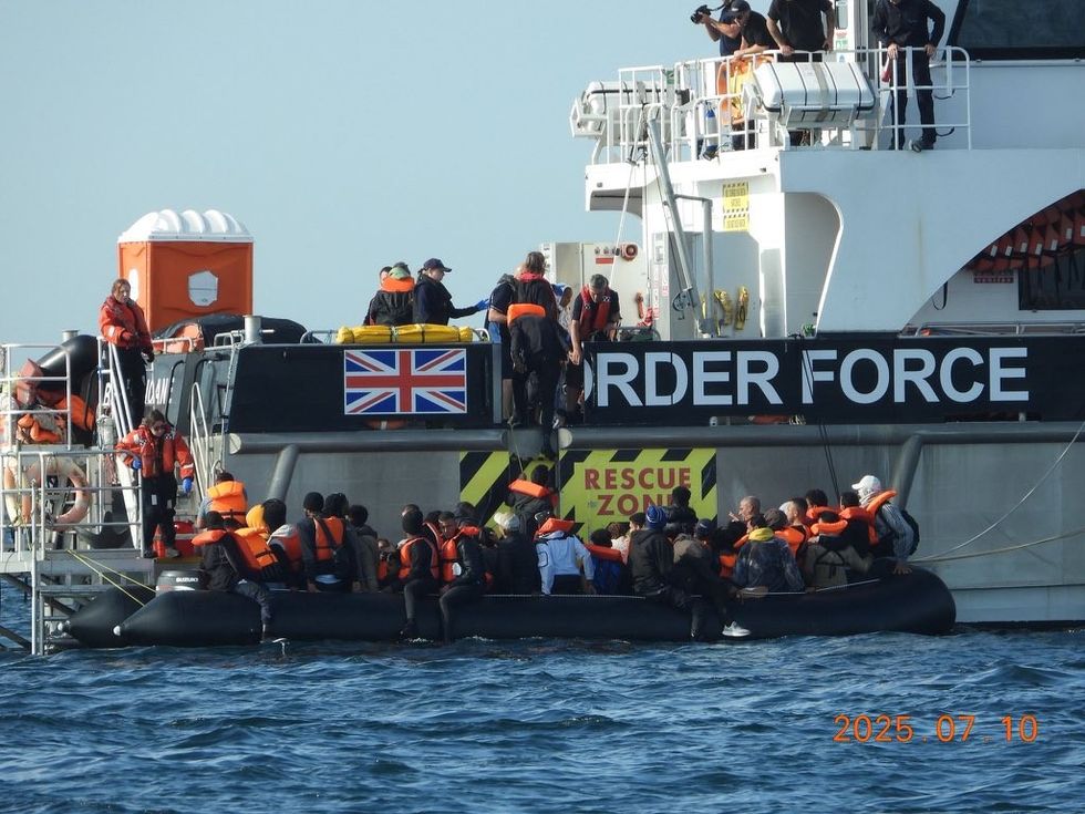 A boatload of young men are handed to a Border Force vessel this morning