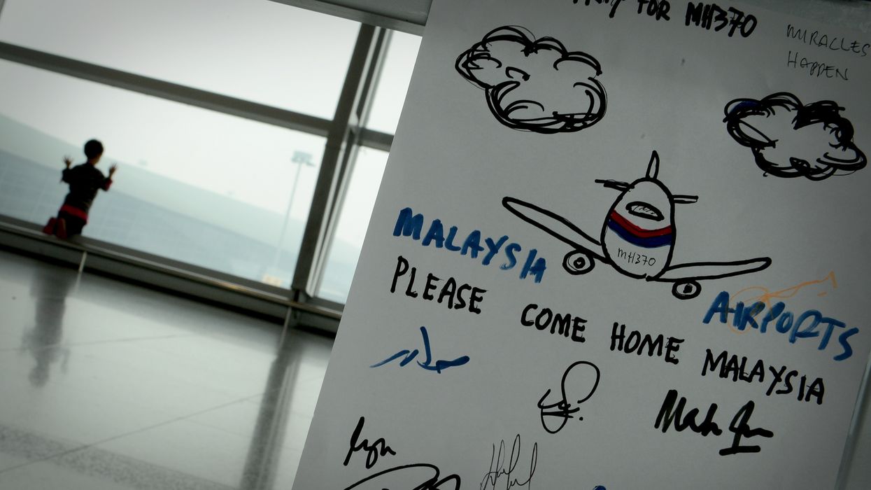 A boy waits for his family members to arrived at the KLIA on March,13, 2014