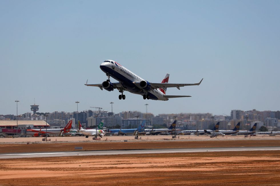 A British Airways airplane takes off from Faro airport amid the coronavirus disease pandemic, in Faro, Portugal