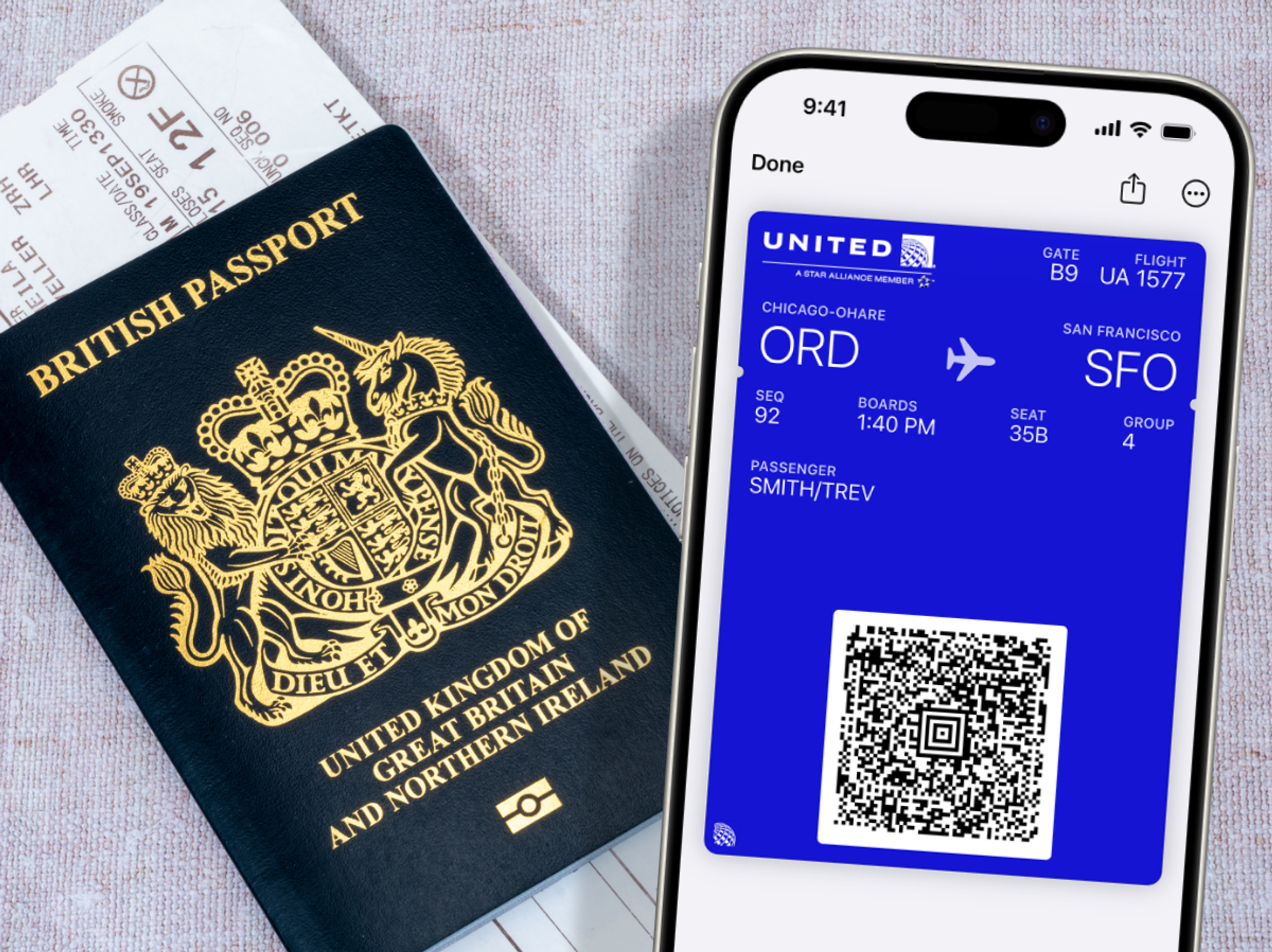 a british passport with a printed boarding pass pictured in the background, with the wallet app showing a boarding pass in the foreground