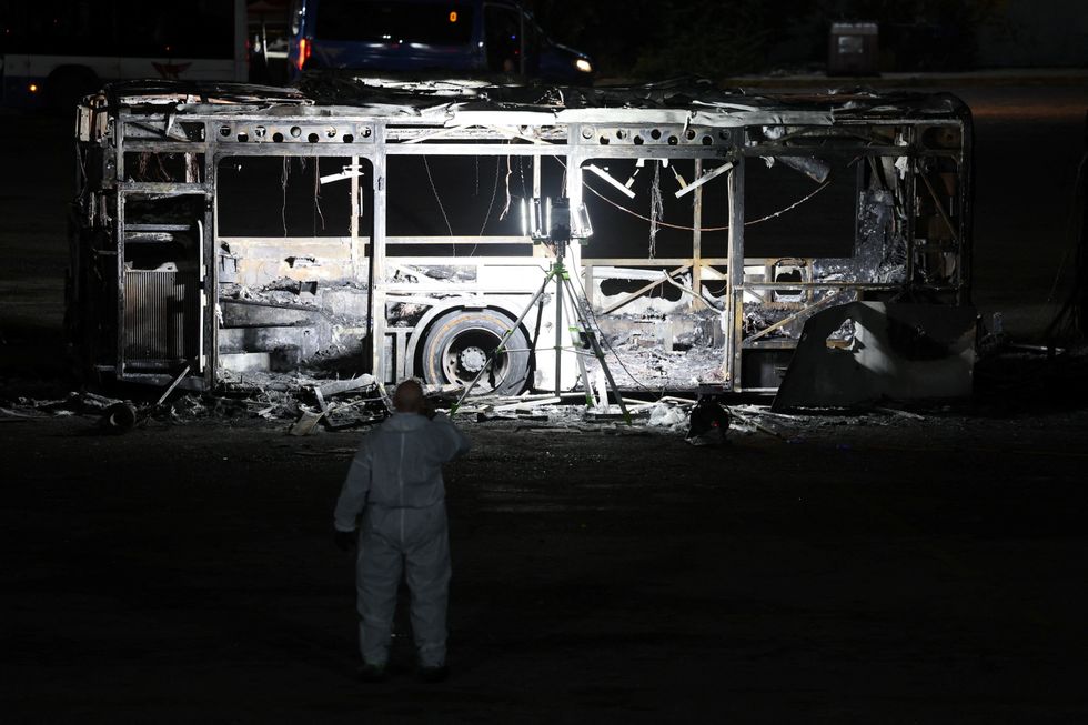 A burnt-out bus after the 'suspected terror attack'
