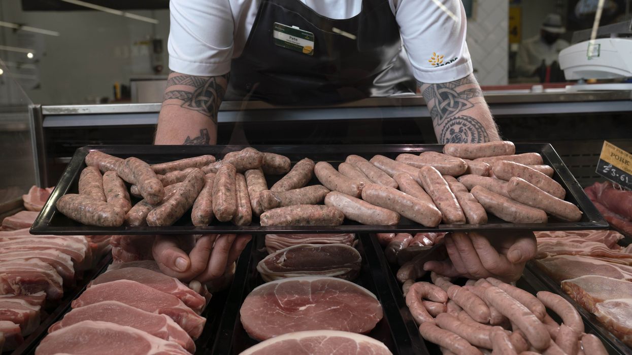 A butcher presents his product