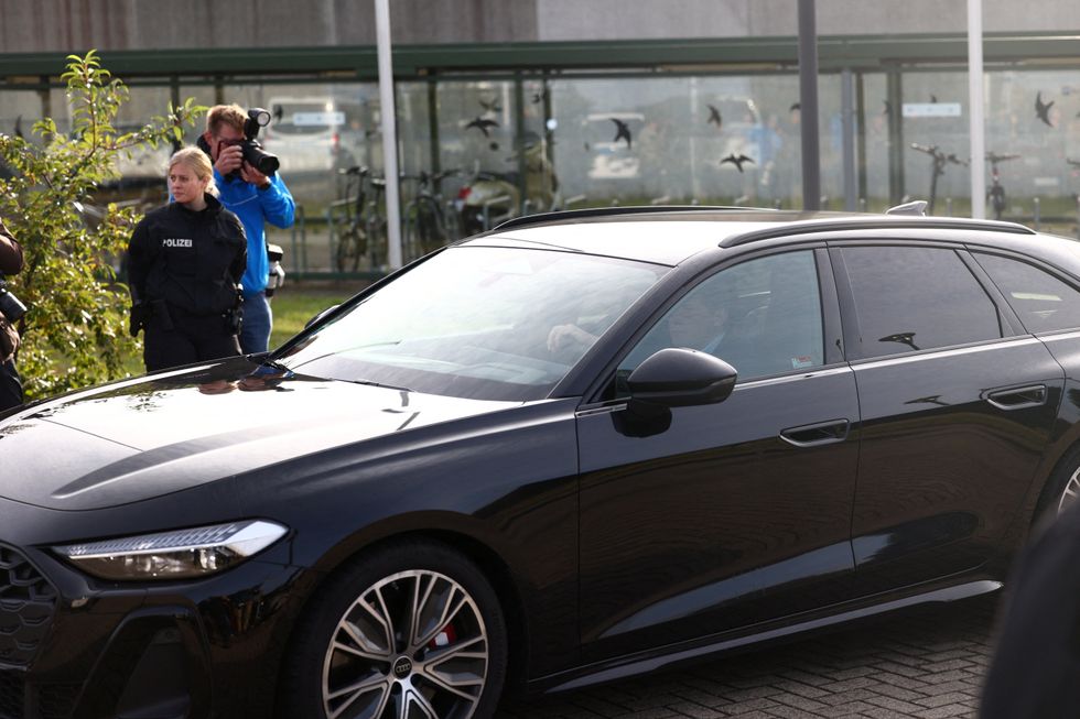 A car believed to be carrying Mr Brueckner driving away from the prison