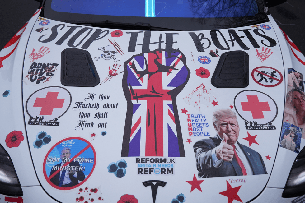 A car covered in graffiti messages during a protest in Crowborough