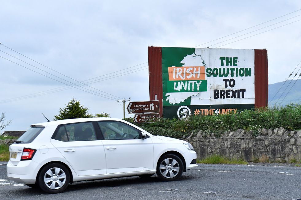 A car drives past a Brexit poster, in Ravensdale, Northern Ireland June 21, 2022. Picture taken June 21, 2022. Under the Post-Brexit Northern Ireland protocol, continued access to the European Union's single market at the expense of the rest of the United Kingdom is proving beneficial for the region's exporters in tougher economic times. REUTERS/Clodagh Kilcoyne