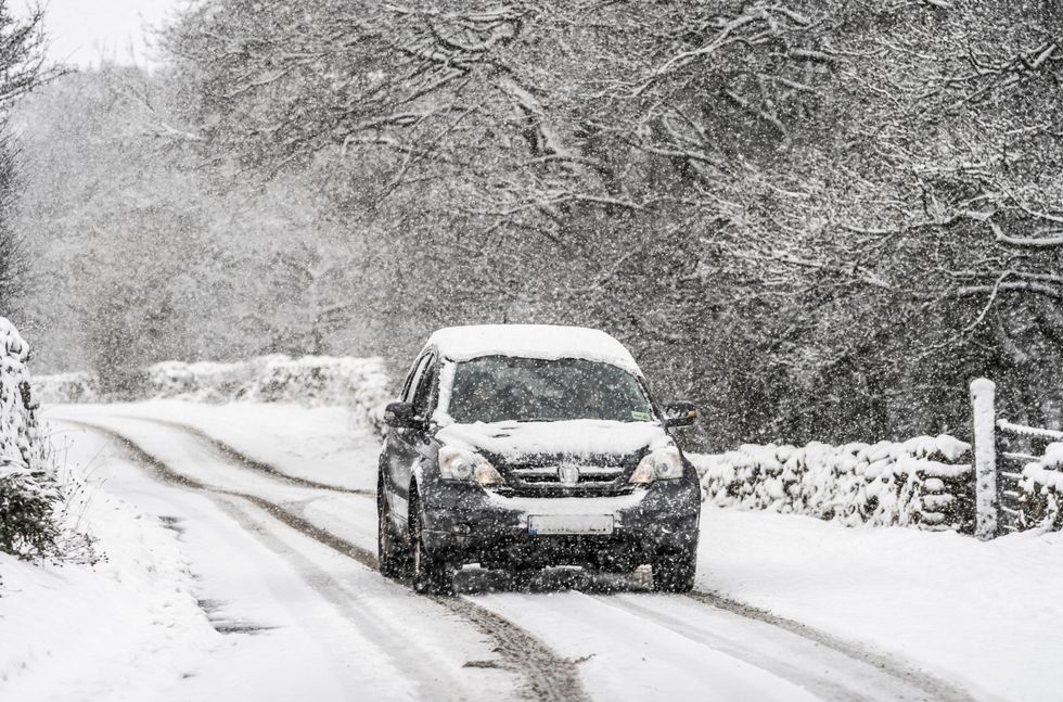 A car drives through the snow in Gunnerside, North Yorkshire. Picture date: Sunday November 28, 2021.