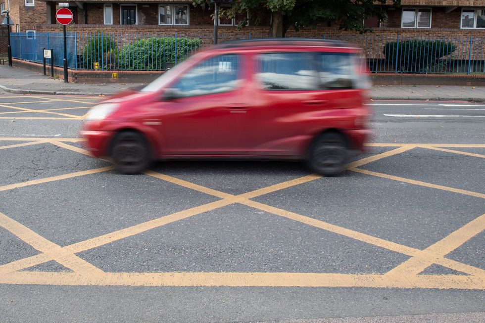 A car in a yellow box junction