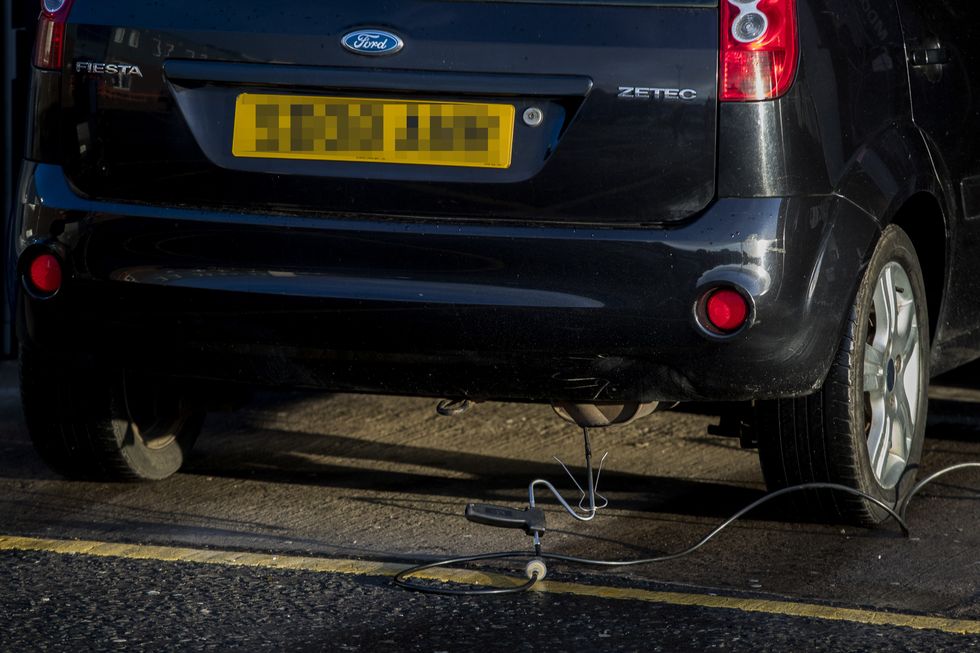 A car undergoing an MOT test.