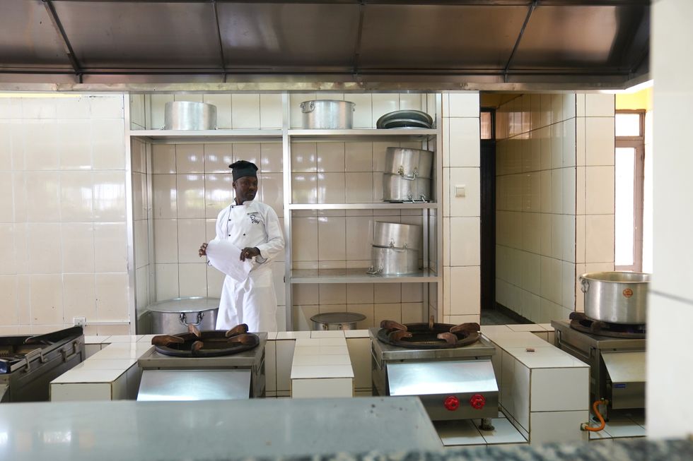 A chef works in the kitchen at the Hope Hostel in Kigali, Rwanda