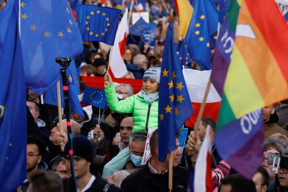 A child holds a flag during a rally in support of Poland's membership in the European Union.
