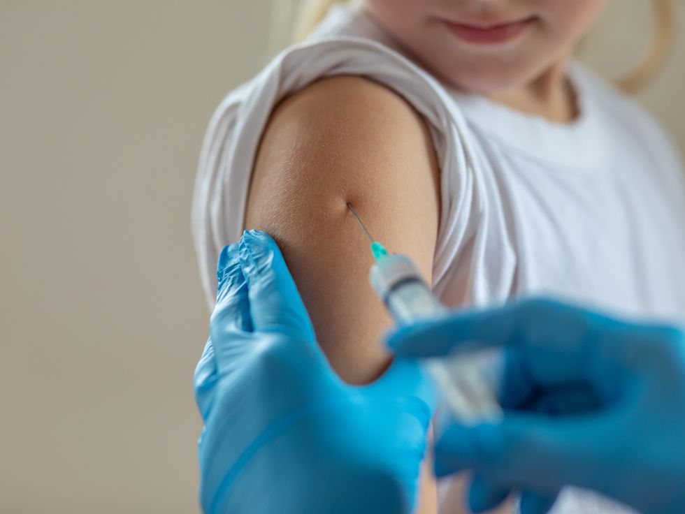 A child receives a vaccine