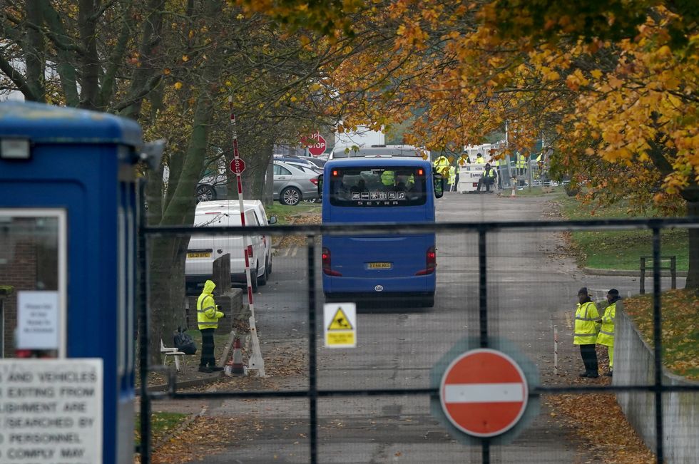 A coach carrying people thought to be migrants arrives at the Manston immigration short-term holding facility in Thanet, Kent, following a number of small boat incidents in the Channel. Picture date: Monday November 14, 2022.