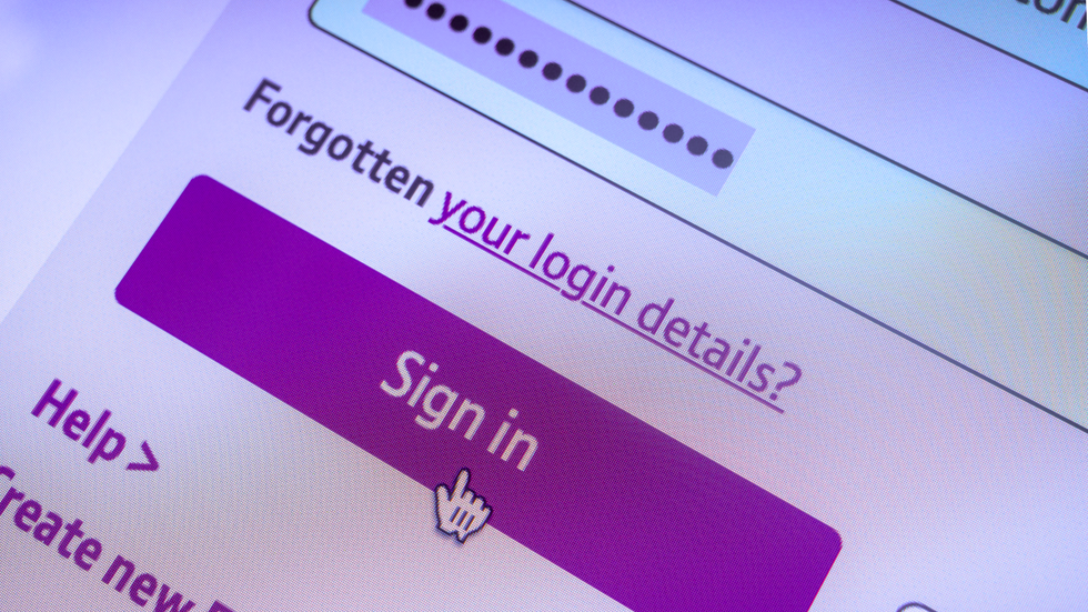 a computer mouse hovers over the sign in button of a password login field on a website 