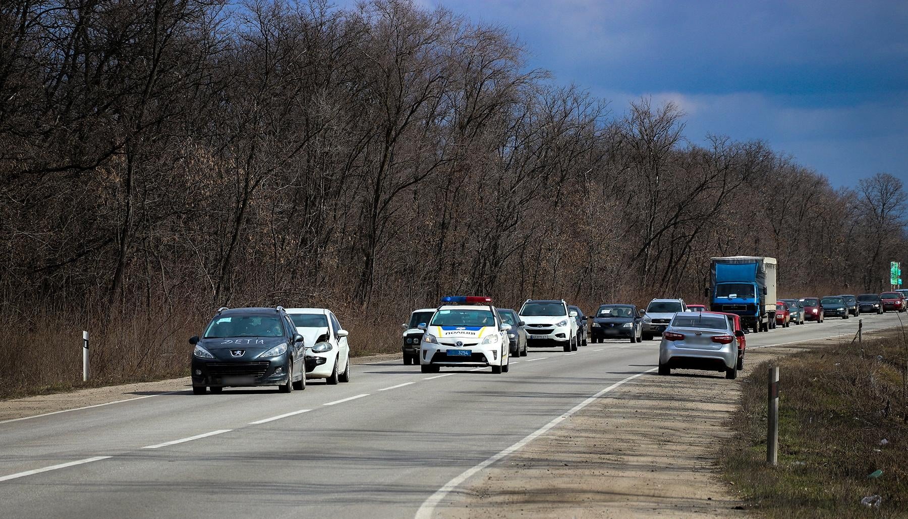 A convoy of cars with people fleeing from Mariupol amid Russia's invasion of Ukraine is seen in the Zaporizhzhia region.