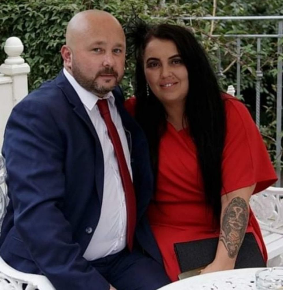 A couple sat down outside