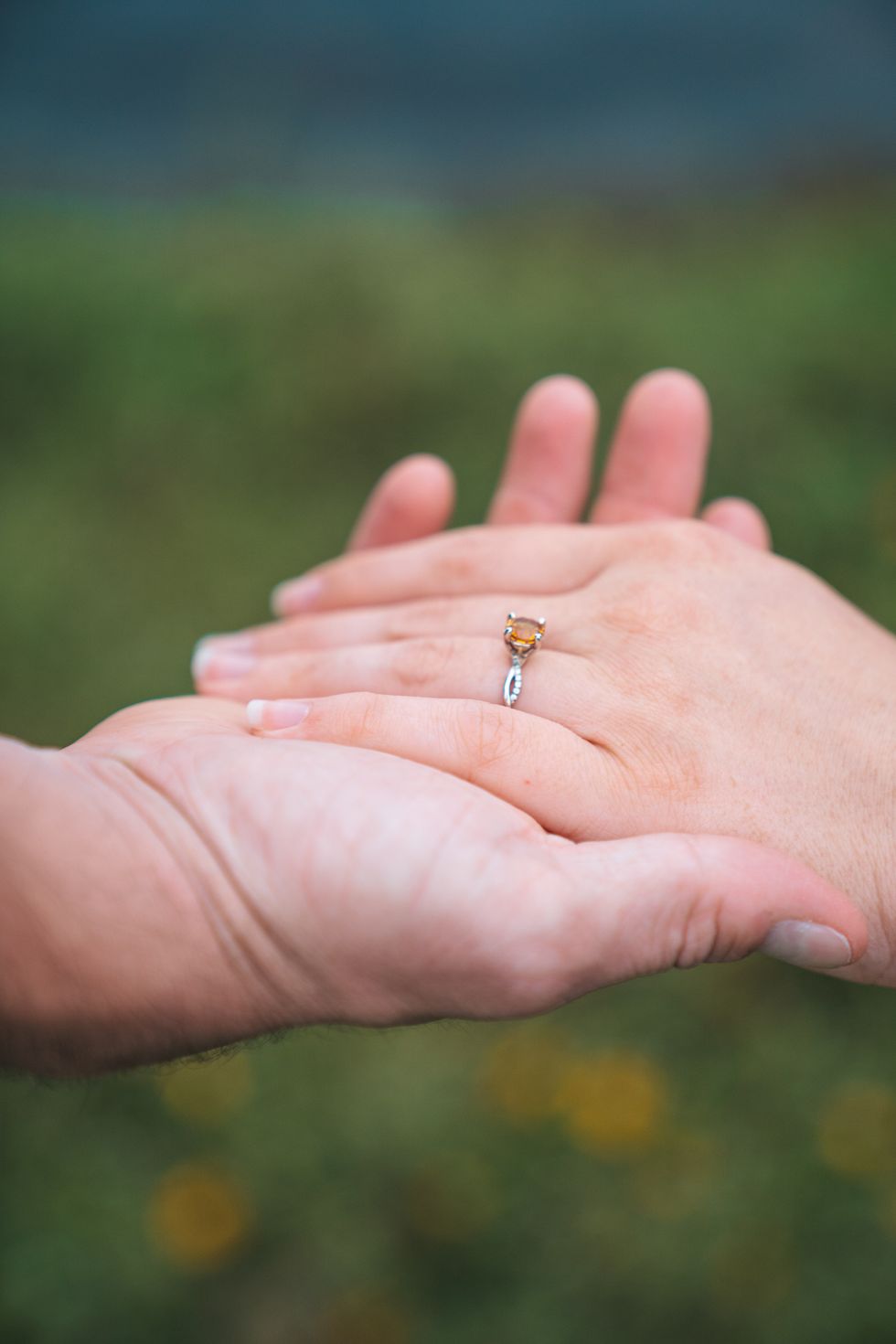 A couple showing their engagement ring