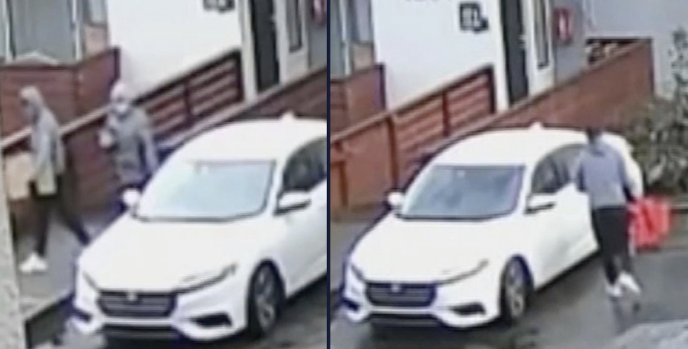A couple stood by a car