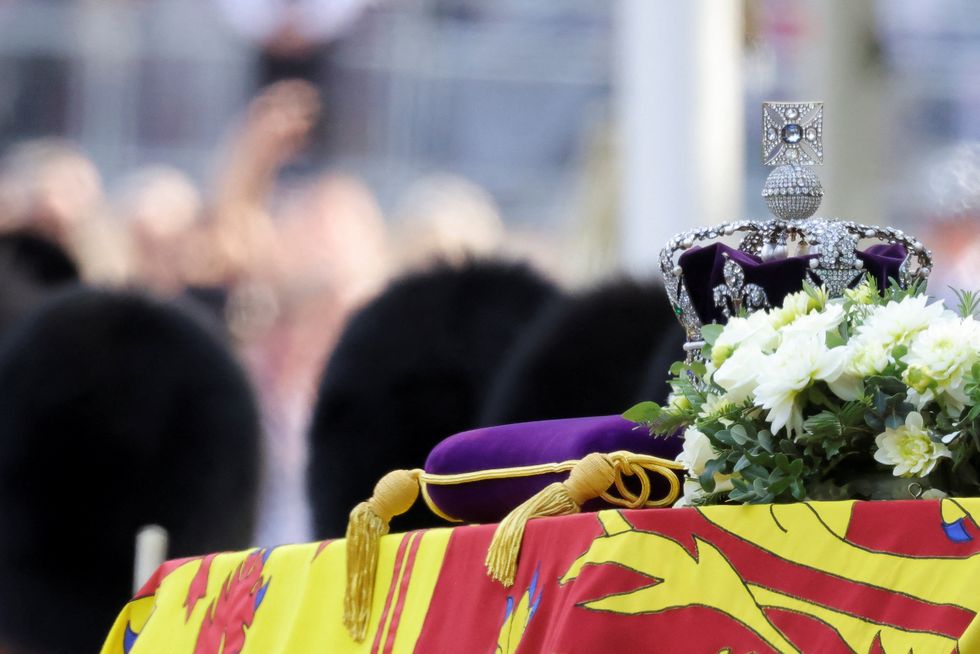 A crown is pictured during the procession of the coffin of Britain's Queen Elizabeth from Buckingham Palace to the Houses of Parliament for her lying in state, in London, Britain, September 14, 2022. REUTERS/Marko Djurica/Pool