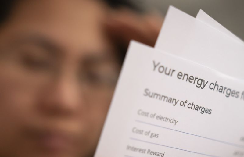 A customer looks at their energy bill