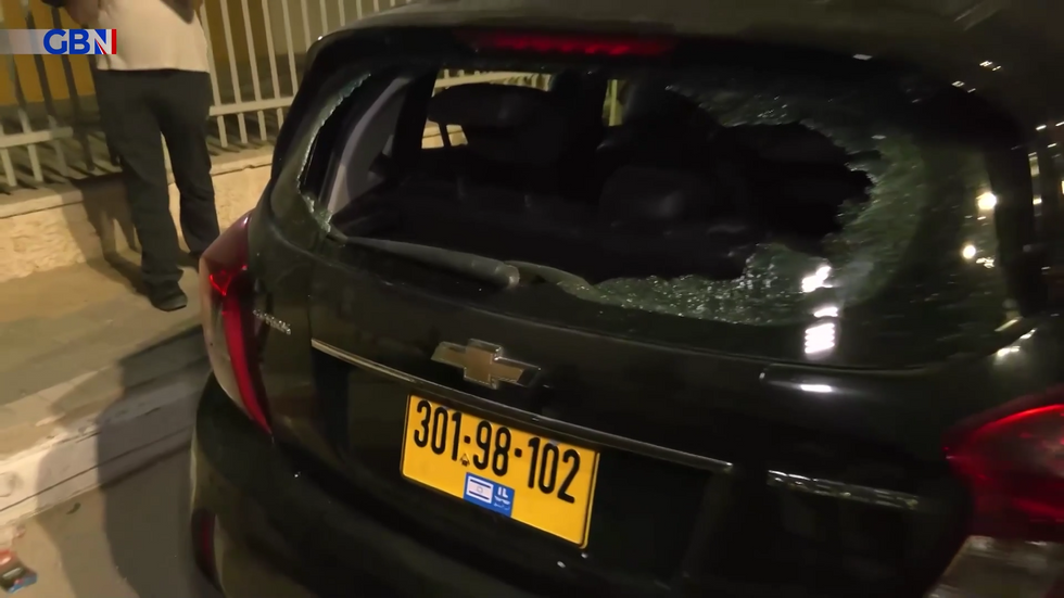 A damaged vehicle after the rocket attack