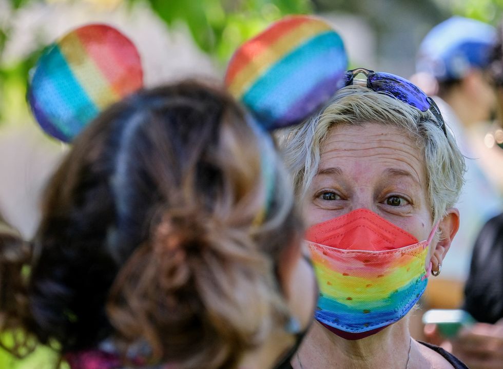 A demonstrator wearing a rainbow colour face mask takes part in a protest as Disney's employees demonstrate against Florida's %22Don't Say Gay%22 bill, in Glendale, California, U.S., March 22, 2022. REUTERS/Ringo Chiu/Ringo Chiu