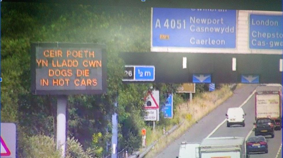 A 'dogs die in hot cars' roadside sign