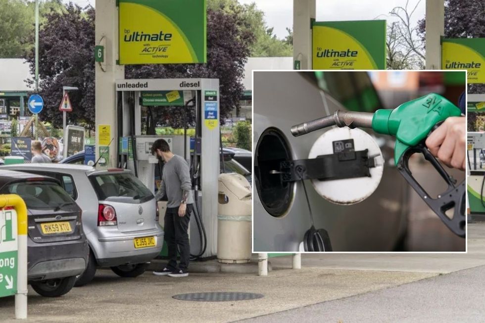 A driver filling up their car with fuel and a petrol pump