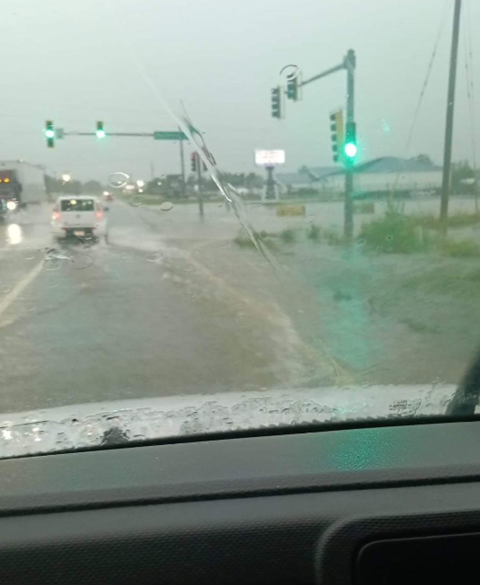 A driver on a flooded road