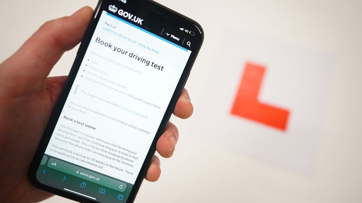 A driving test booking screen and a learner plate