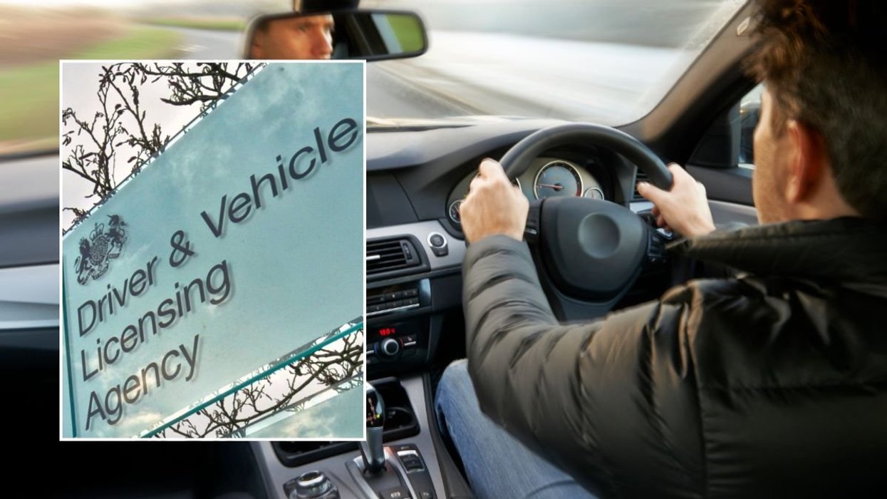 A DVLA sign and a man driving in a car