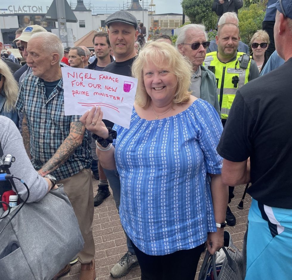 A Farage fan holding a placard