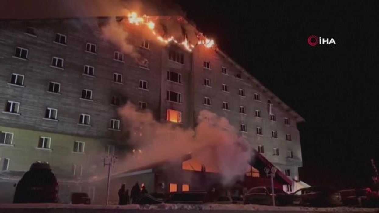 Two people dead after fire rips through ski resort as hotel goes up in flames