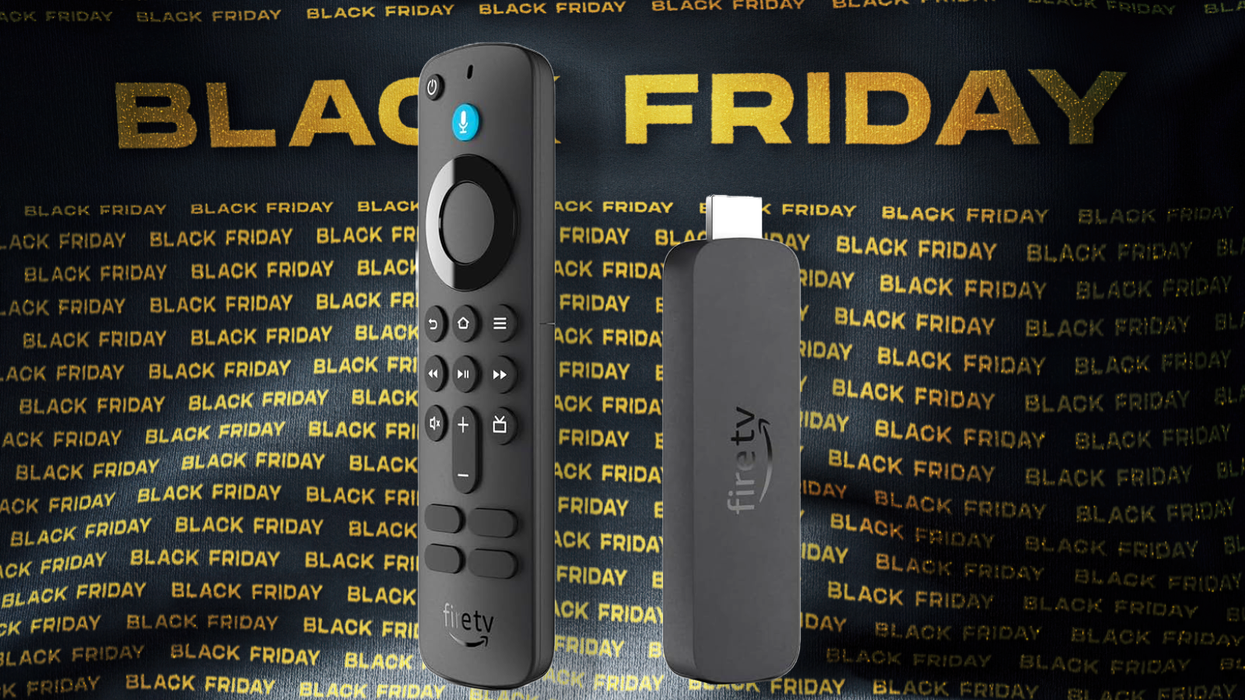 a fire tv stick 4k pictured with the alexa remote on a black friday banner